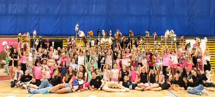 Group of Hobby Horsing participants holding Hobby Horses at the LarDen Tournament 2026