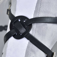 Close-up of the Noseband Mexico Black by Hobby Horse LarDen, featuring a decorative knot in black leatherette, displayed on a white plush surface—possibly part of a harness or bridle for hobby horses.