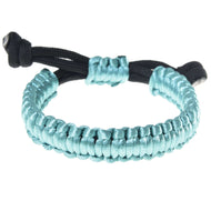 The Bracelet Turquoise by Hobby Horse LarDen features a handmade aqua blue woven cord with black adjustable ends, resembling a fine rope set, and is displayed on a white background.