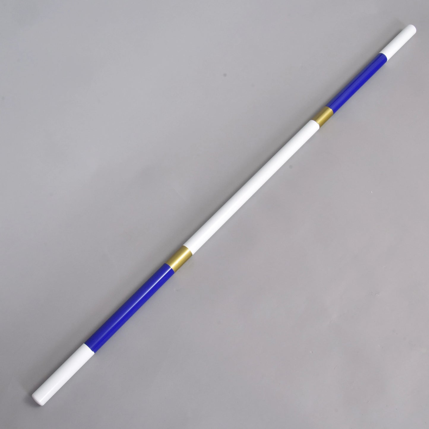 The Hobby Horse LarDen Jump Pole Blue-Gold is a lightweight 32 mm coated PVC pole with blue ends, white middle sections, and two gold rings. It features alternating white, blue, and gold segments and is displayed diagonally on a light grey background.
