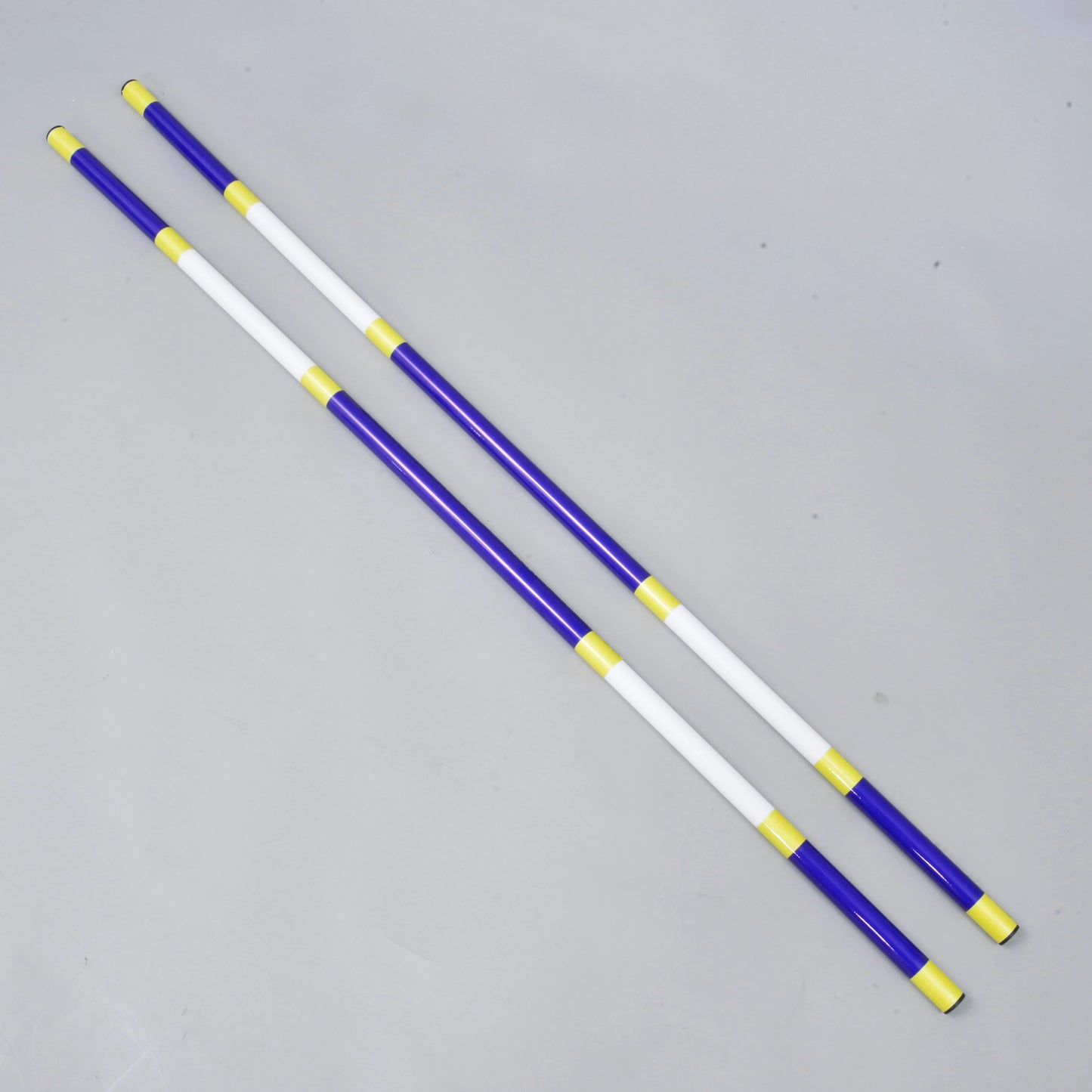 Two lightweight Hobby Horse LarDen Jump poles (blue-white, 2 pcs), each 32 mm diameter coated PVC, lie parallel on a light gray surface.