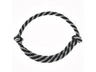 The “Cordeo black stripe” by Hobby Horse LarDen—a black and white striped cordeo, commonly used for bridleless riding or with a hobby horse—is coiled in a circle with knots at both ends and displayed against a white background.