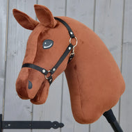A “Build your horse” hobby horse by related_to_12441055625556 features a dark chestnut head with upright ears, button-like eyes, and a black bridle, all mounted on a stick and displayed against a wooden background.
