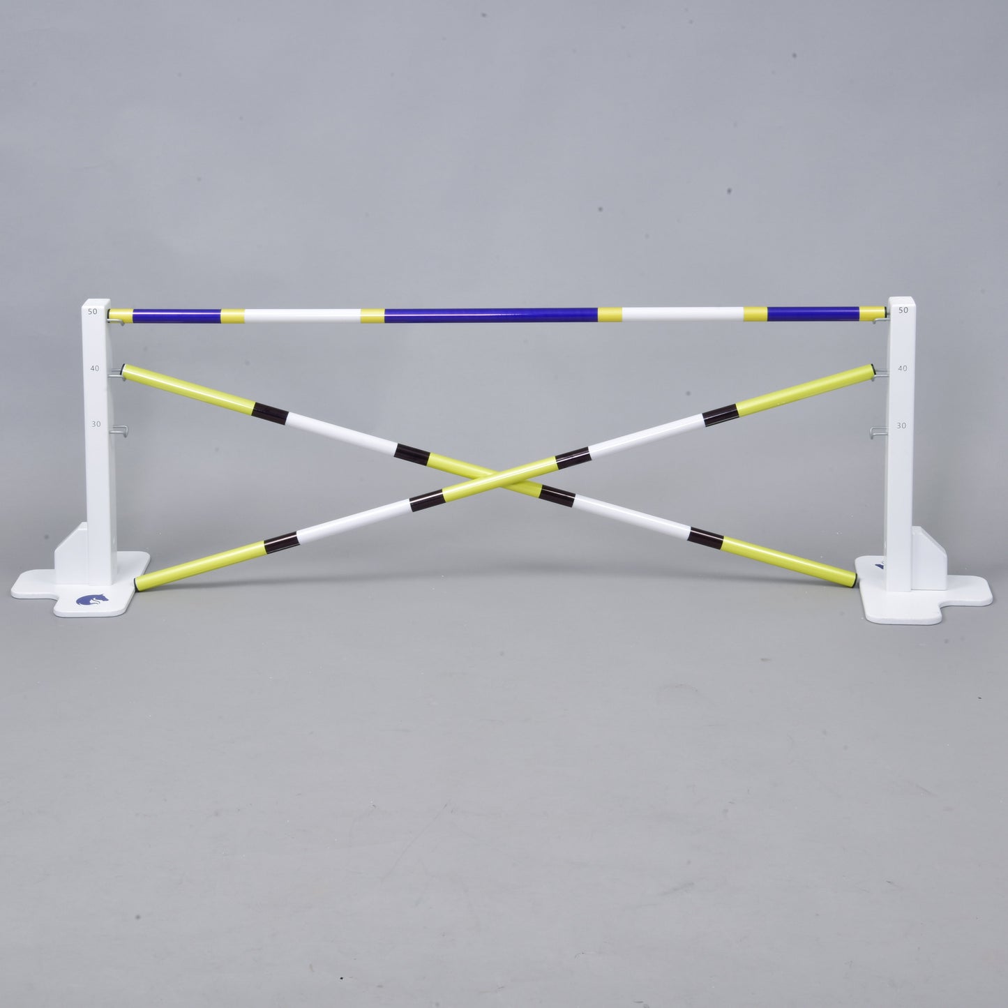 The Hobby Horse LarDen Jump 50 cm / 20 inch with Extra Poles is a white and yellow adjustable hurdle with crossed bars and measurement markings—ideal for hobby horsing and fun indoor or outdoor activities.